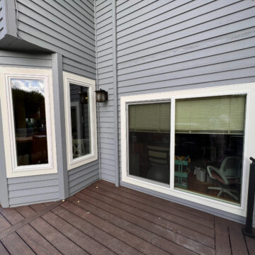 Charming Beaverton home with a deck and windows ready for an Exterior Paint Makeover.