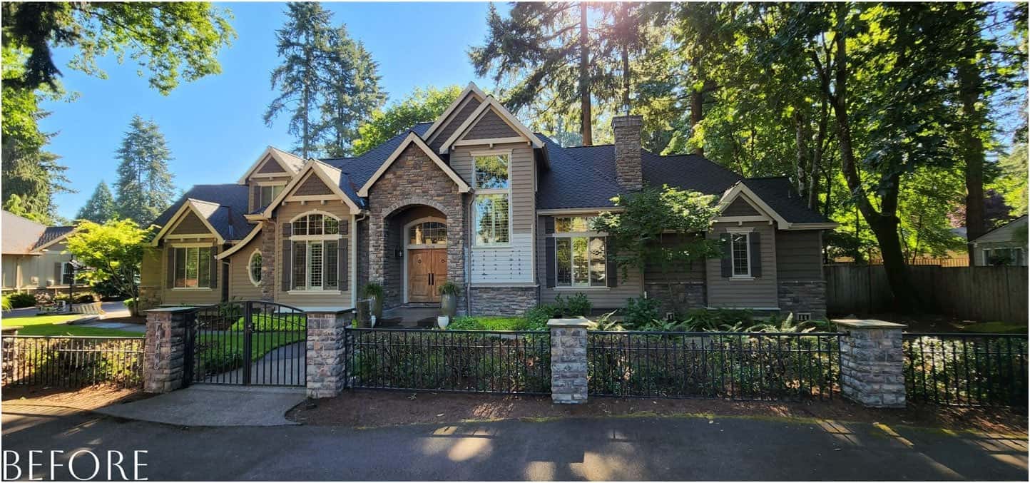 A home with a fence and trees in front of it, beautifully transformed by the Pearl Painters.