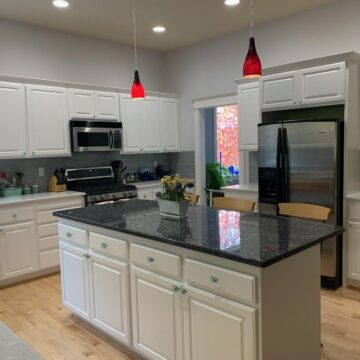 kitchen cabinets and island painted by Pearl Painters