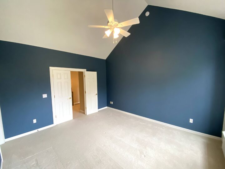 bedroom with tall ceilings professionally painted blue