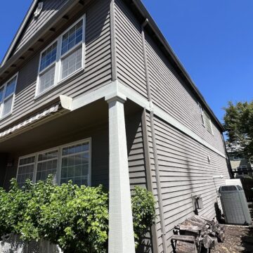 Gray two-story Feldon house in Portland with white trim, large windows. Pearl Painters handled the painting in July 2025.