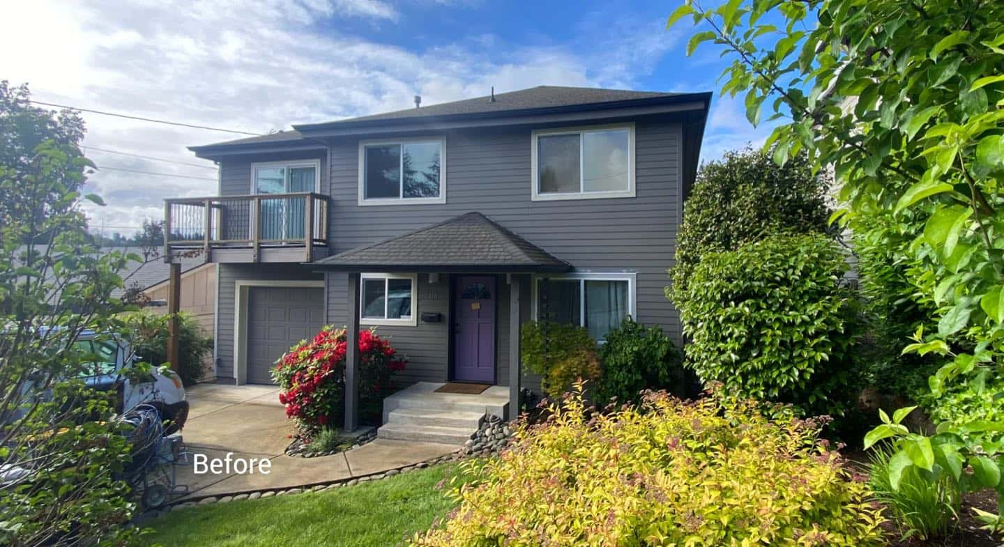 A house with purple siding, professionally painted by Pearl Painters. The front yard is beautifully landscaped with bushes.