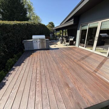 This Godbey home in Portland features a spacious deck with a grill and barbecue. Pearl Painters, a local painting company, recommends scheduling your exterior painting or deck staining before outdoor gatherings begin in April 2025.