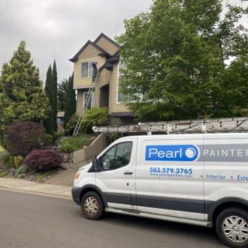 Pearl Painters recently completed a fresh coat of paint on a van parked in front of a house.