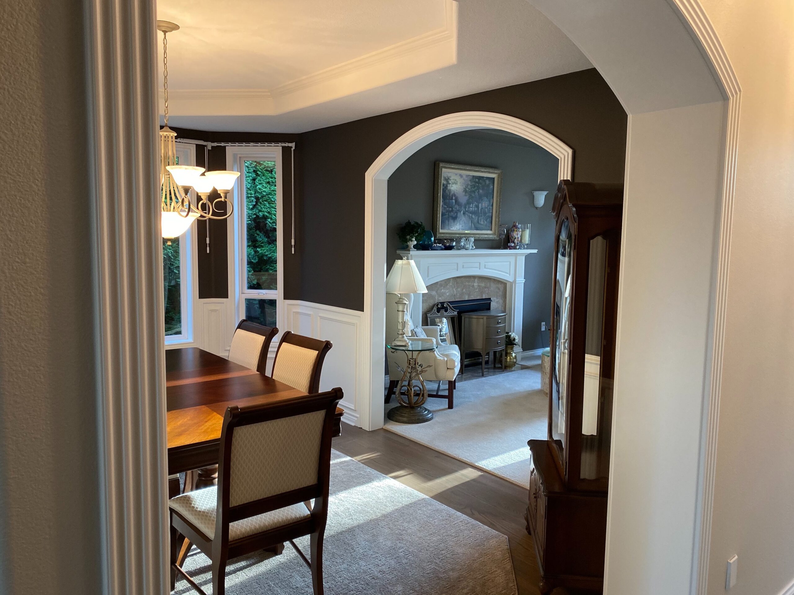 A holiday-ready archway leads to a home dining room.