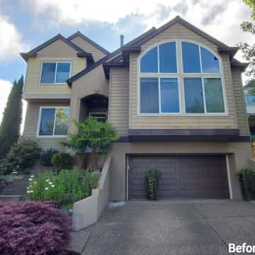 Tigard homes with a fresh coat of paint, including a garage and driveway.
