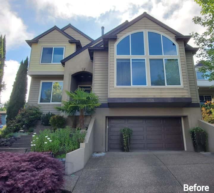 Tigard homes with a fresh coat of paint, including a garage and driveway.
