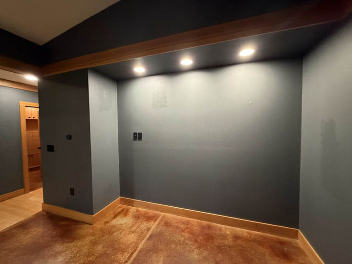 Interior walls with minor damage and uneven paint in Portland.