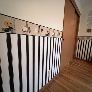 A room with black and white striped walls.