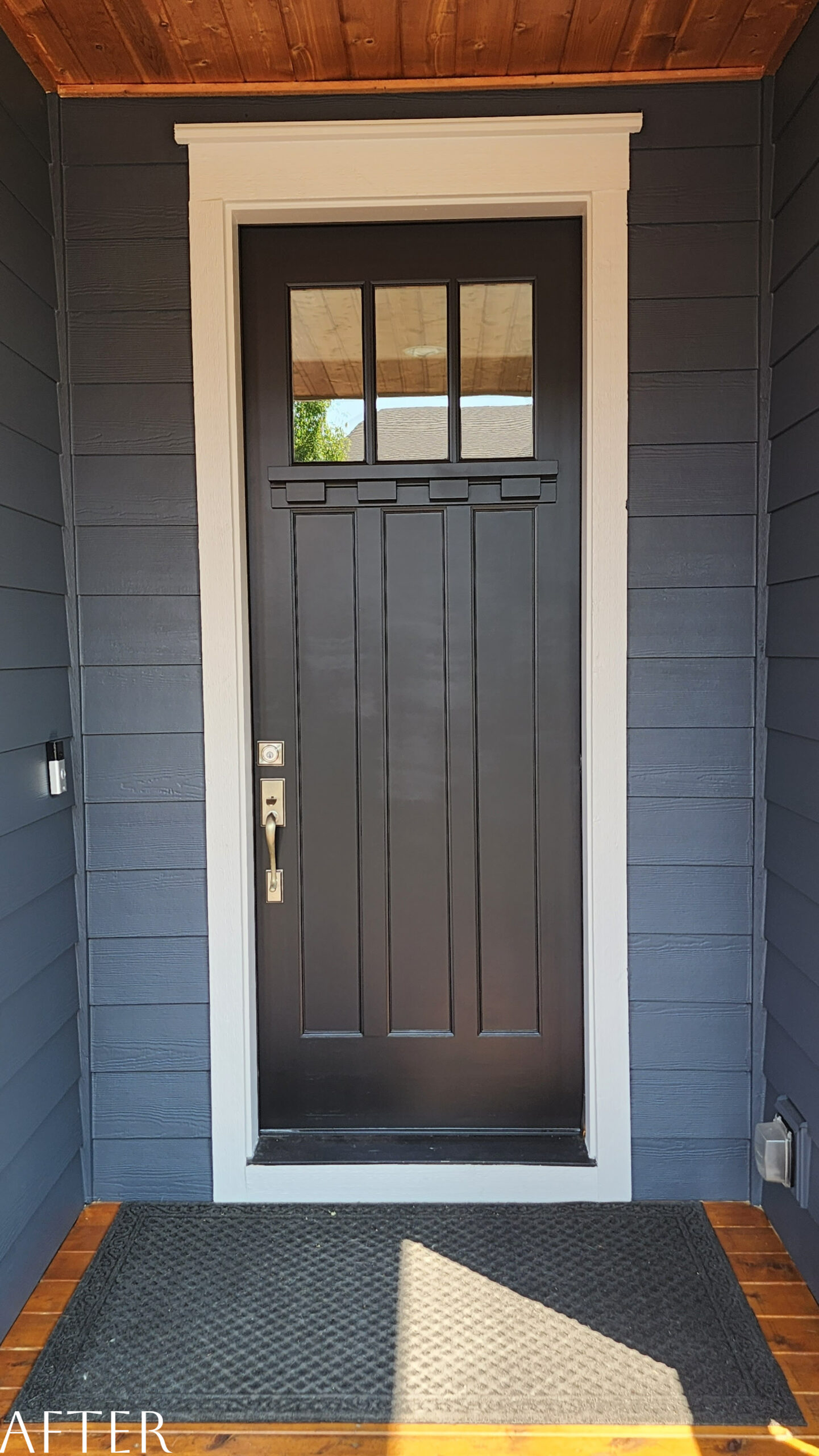 The front door of a home in the Whitford Neighborhood is painted black, giving it a fresh transformation.