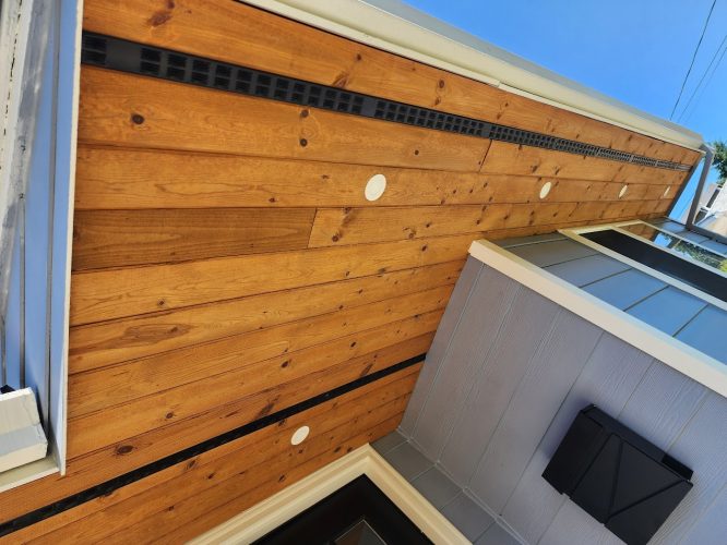 Painter’s view of Arnold house in August 2025, gray siding and wood soffit with vents, Pearl Painters, Portland.