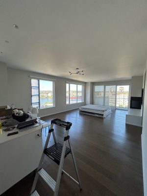 Mostly empty Portland apartment with mattress, ladder, boxes; painter items likely used by Pearl Painters during Allen's 2025 move.