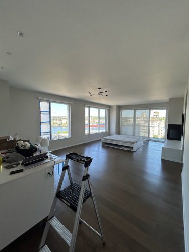 Mostly empty Portland apartment with mattress, ladder, boxes; painter items likely used by Pearl Painters during Allen's 2025 move.