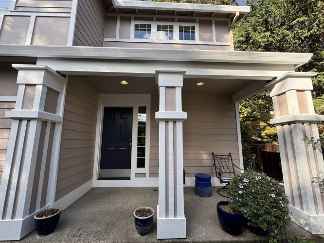 Anderson house porch with taupe siding and white trim painted by Pearl Painters, Portland; square columns, potted plants.