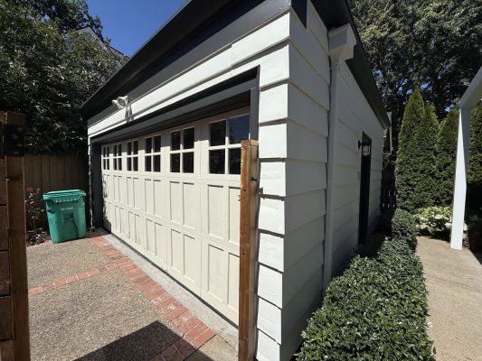White garage with black trim, double door, small top windows. Painted by Pearl Painters, Portland, August 2025.
