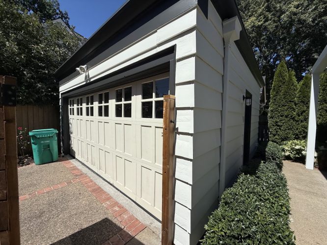 White garage with black trim, double door, small top windows. Painted by Pearl Painters, Portland, August 2025.
