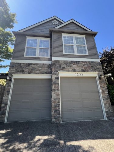 Feldon two-car garage, stone and siding, painting by Pearl Painters, Portland, July 2025.