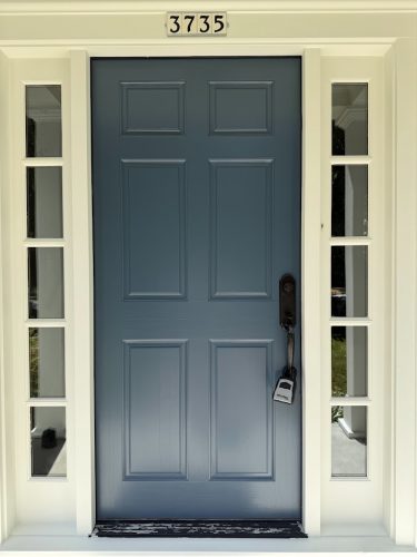 Blue door with black lockbox, white trim, and sidelights. House number 3735. Painted by Pearl Painters in Portland.