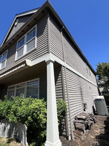 Gray two-story Feldon house in Portland with white trim, large windows. Pearl Painters handled the painting in July 2025.