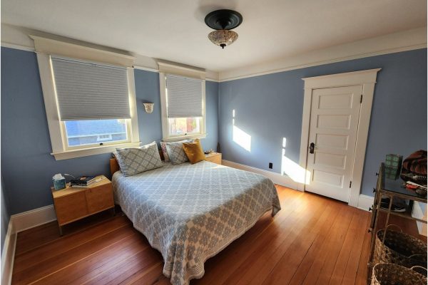 bedroom painted light blue with white trim