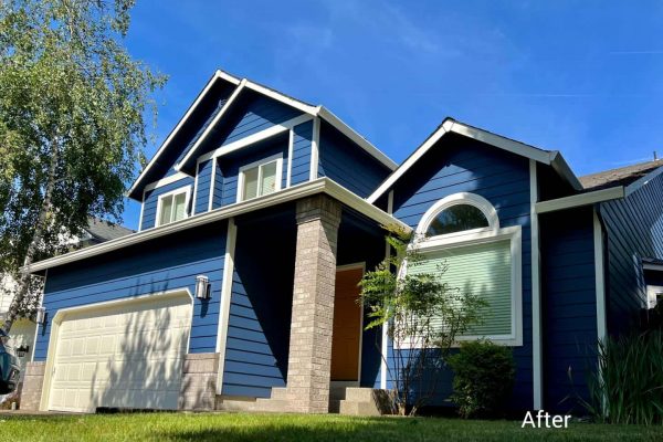 An exterior home in Tigard with blue siding and a garage, boasting a 5-star Google review.