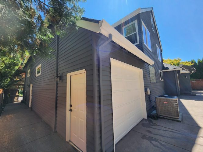 Modern house with dark gray siding in Roberts, ready for Pearl Painters Portland painting job in July 2025.