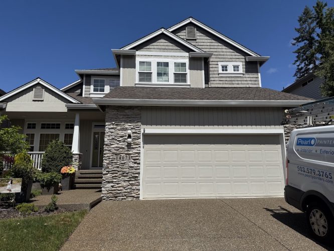 A two-story suburban house with stone accents and a double garage in [location]. A Hendricks Painting service van is parked in the driveway for an exterior painting project scheduled for May 2025. Painter: Pearl Painters, Portland.