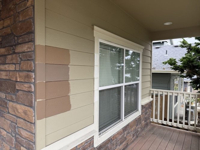 Three exterior paint color samples are shown on the siding near a window, beside a stone wall and small porch railing, as part of Pearl Painters' June 2025 Emory painting project in Portland.