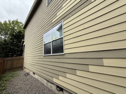 A beige house with horizontal siding and one window, located in Emory, was painted by Pearl Painters of Portland in June 2025.
