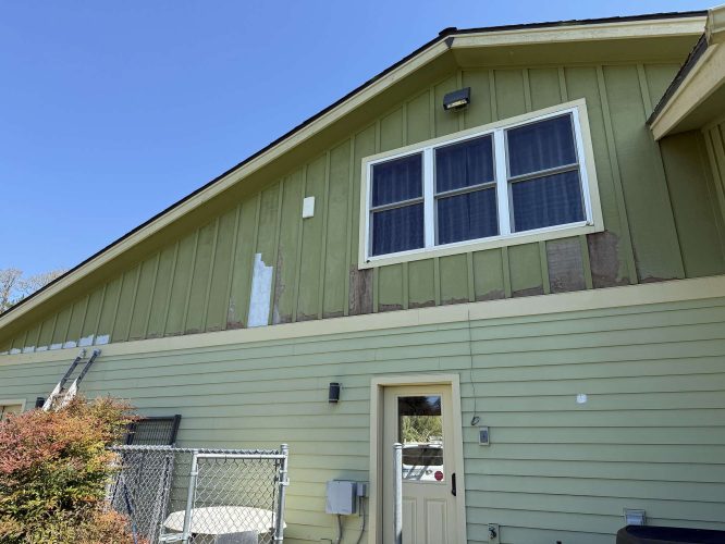 A painting shows peeling green paint and exposed areas below a large double window. A ladder and fencing are visible on the left, documenting the home's condition in April 2025 for McCaffery. Work by Pearl Painters, Portland painter.