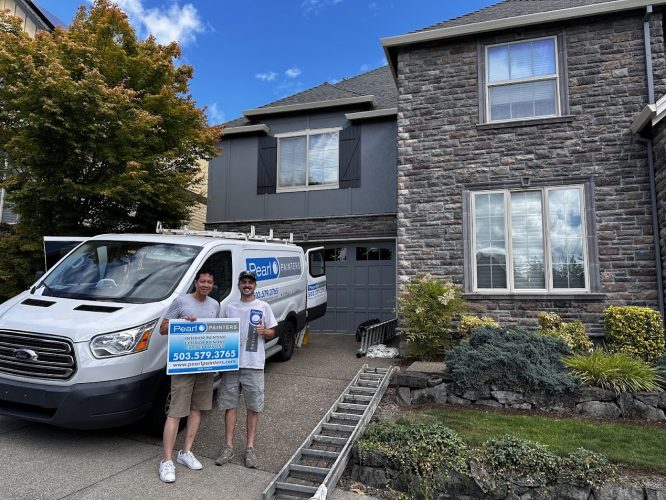 Two people in Portland stand by a Pearl Painters van and ladder, holding a sign for their July 2025 painting project.
