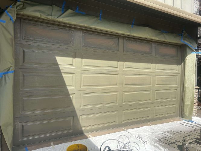 Pearl Painters' painter Taylor completed this exterior garage door painting in Portland in April 2025, using masking and drop cloths to protect surrounding areas.