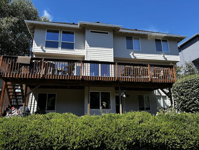 Two-story Featherstone home in Portland with light siding, balcony, large windows; Pearl Painters prepped for painting by Aug 2025.
