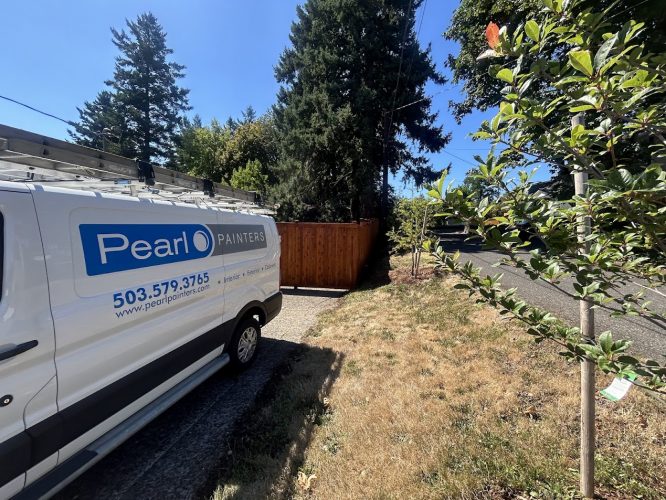 Pearl Painters van parked on driveway by grass and trees, ready for exterior painting in Portland, under clear August sky.