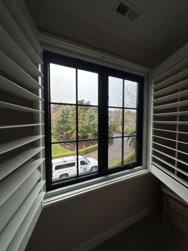 A Pearl Painters painting shows a window with black grid panes and open white shutters, looking out on trees, grass, and a white van—an April 2025 scene near Portland.