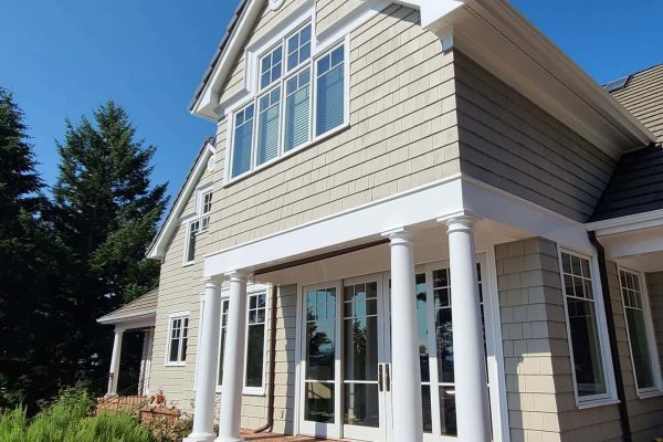 The exterior of a home in Oregon City with columns and pillars that may require re-painting.