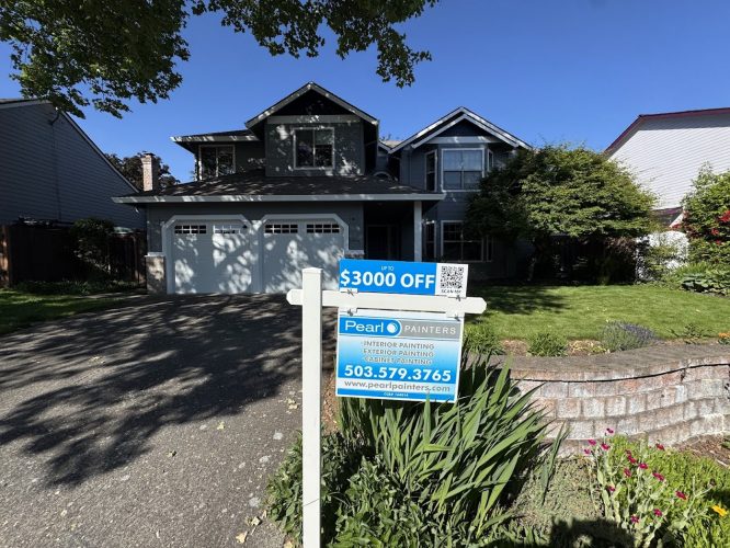 Suburban two-story house in Portland with a driveway, lawn, and sign for Pearl Painters’ $3000 painting discount.