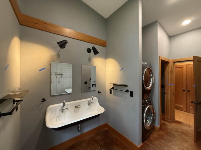 Bathroom interior with large white sink before being painters.