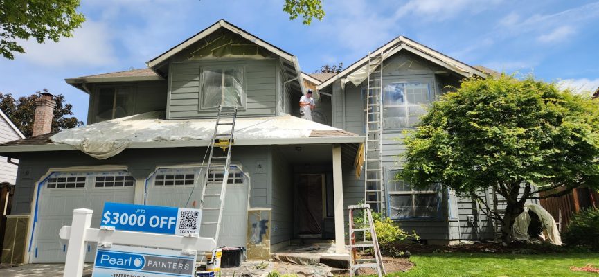 Painters from Pearl Painters paint a two-story house light gray in Portland; "$3000 OFF" sign posted in the yard.