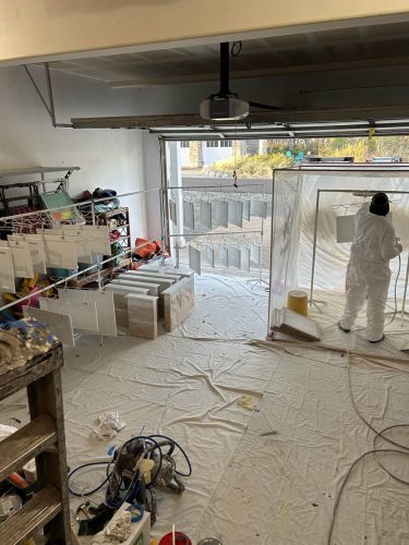 Pearl Painters professionally spraying cabinet doors