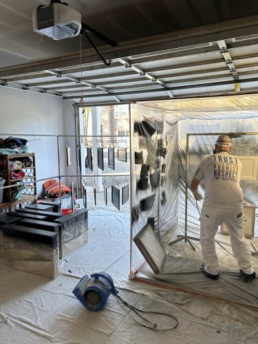 Pearl Painters professionally spraying cabinet doors