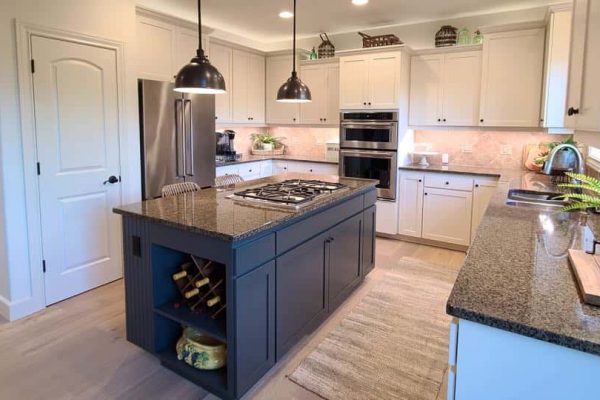 kitchen with white cabinets repainted, and blue island - all professionally painted