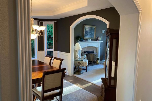 dark burgundy accent wall with white wainscoting, professionally painted in Portland