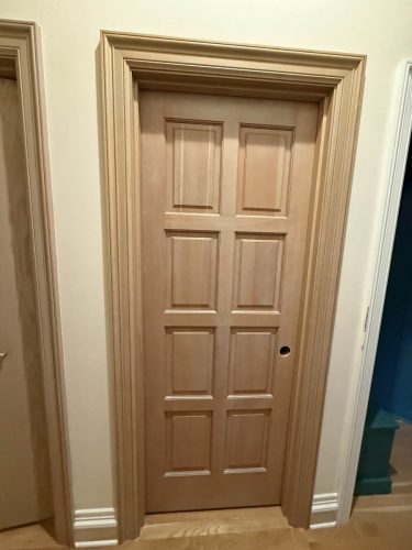 Portland home interior wooden door before professionally painted