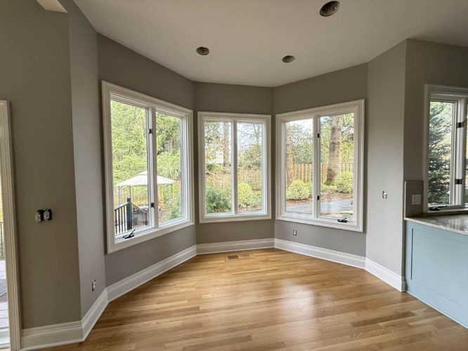 Bay window area inside Portland home, freshly painted a neutral tone
