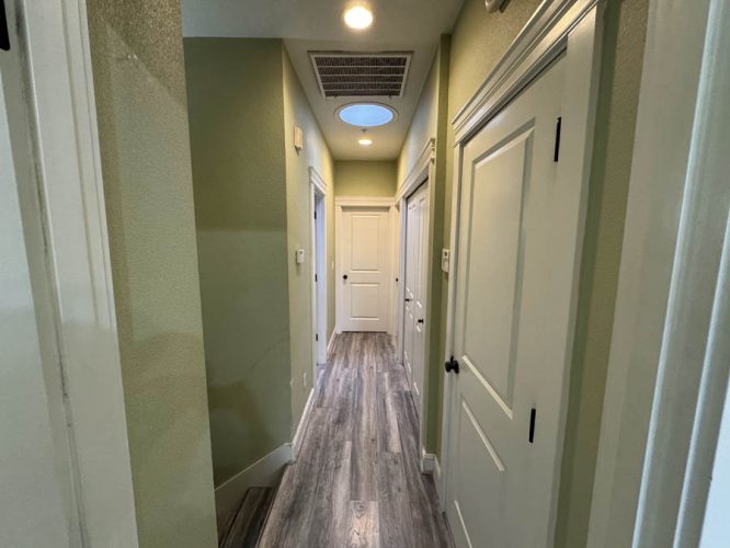 hallway with several doors and hard flooring in Portland
