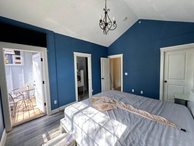 bedroom with vaulted ceiling freshly painted dark blue