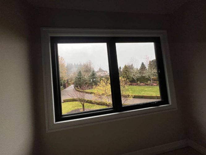 Interior view - New black windows installed with old white trim, before being painted