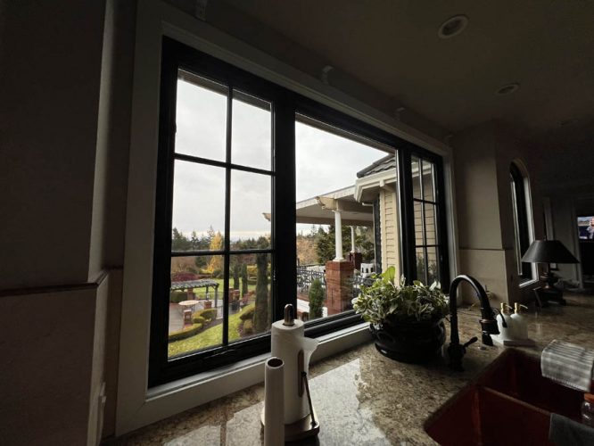 Window in front of kitchen sink before trim gets painted