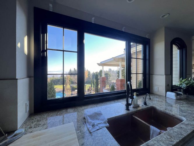 Kitchen window with black trim, after being painted by Pearl Painters in West Linn